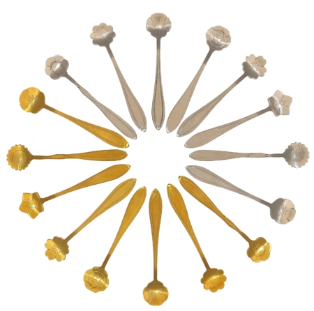 Circle of silver and gold flower spoons